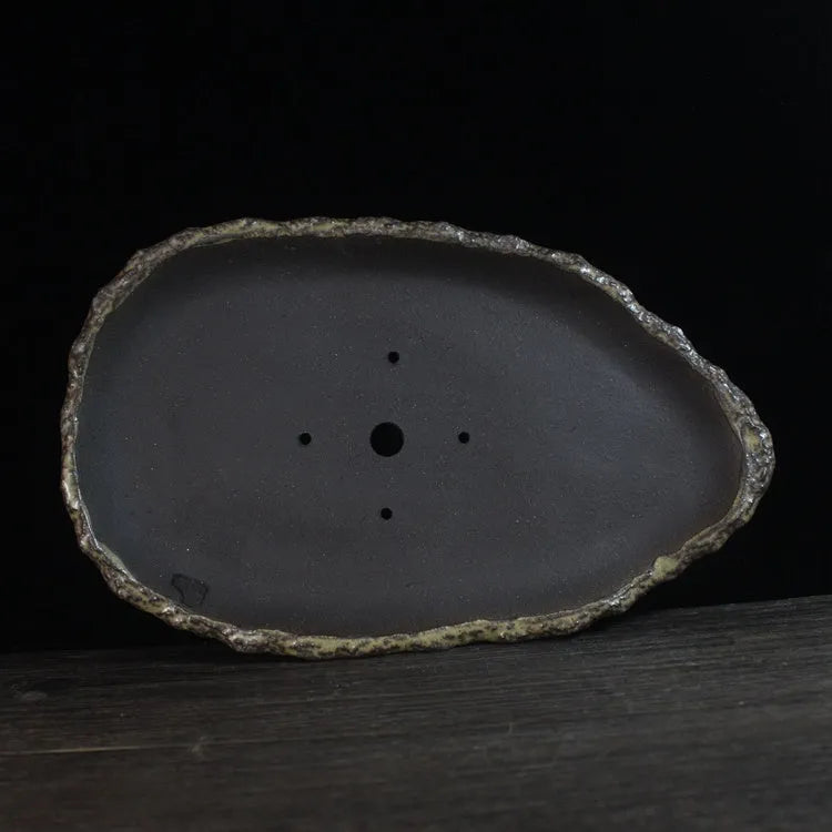Handmade purple clay flower pot showing traditional craftsmanship and floor-standing design