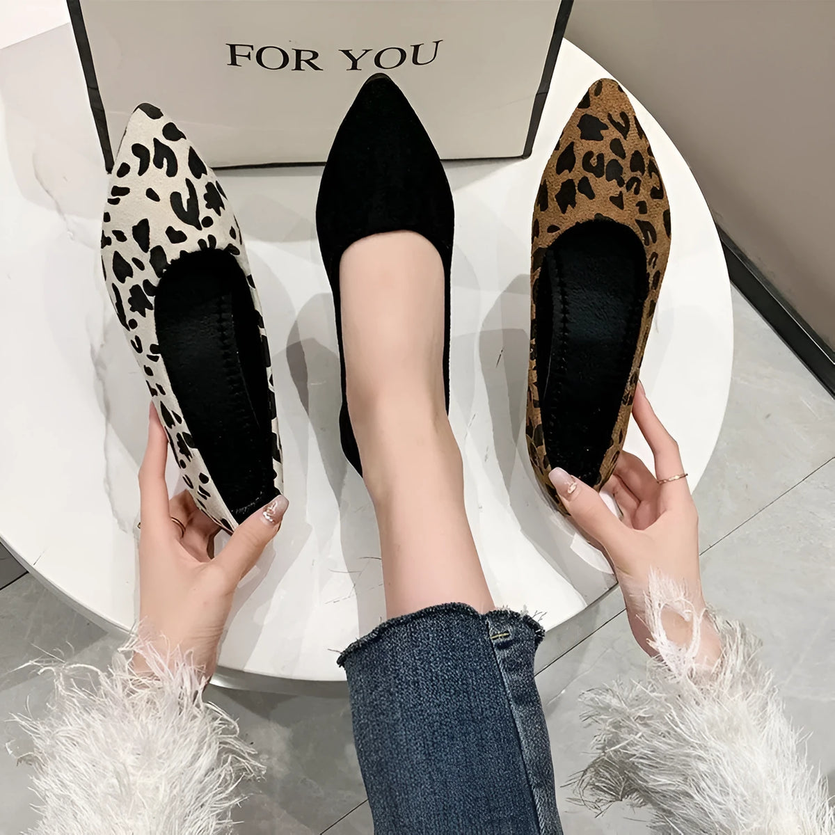 Women's leopard print pointed toe flat pumps with low heel on white background