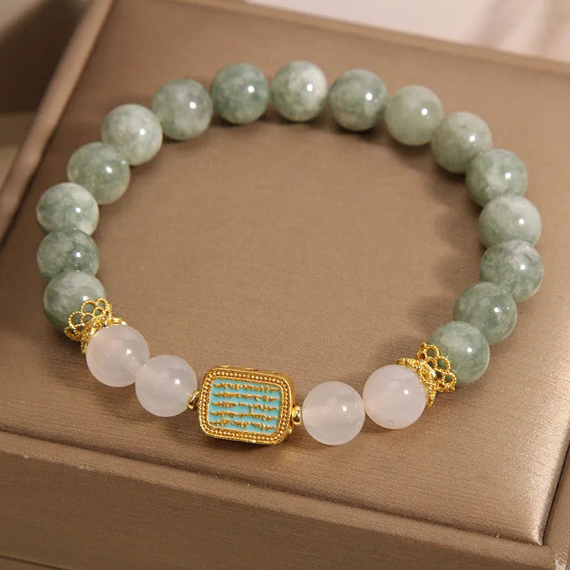 Women's crystal bracelet with oil green emerald stones and a scripture charm