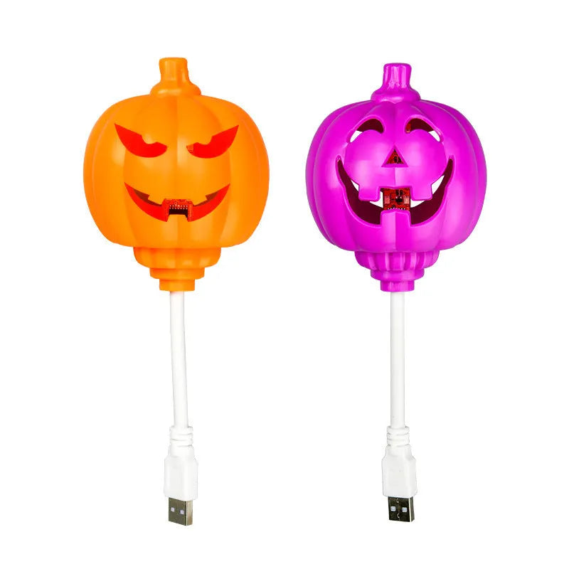 Plastic pumpkin lamp with yellow or purple light option, USB charging, 8.3cm wide by 22cm tall