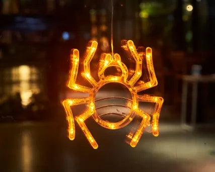Halloween battery-powered LED window lights with suction cups showing spider, pumpkin and ghost designs
