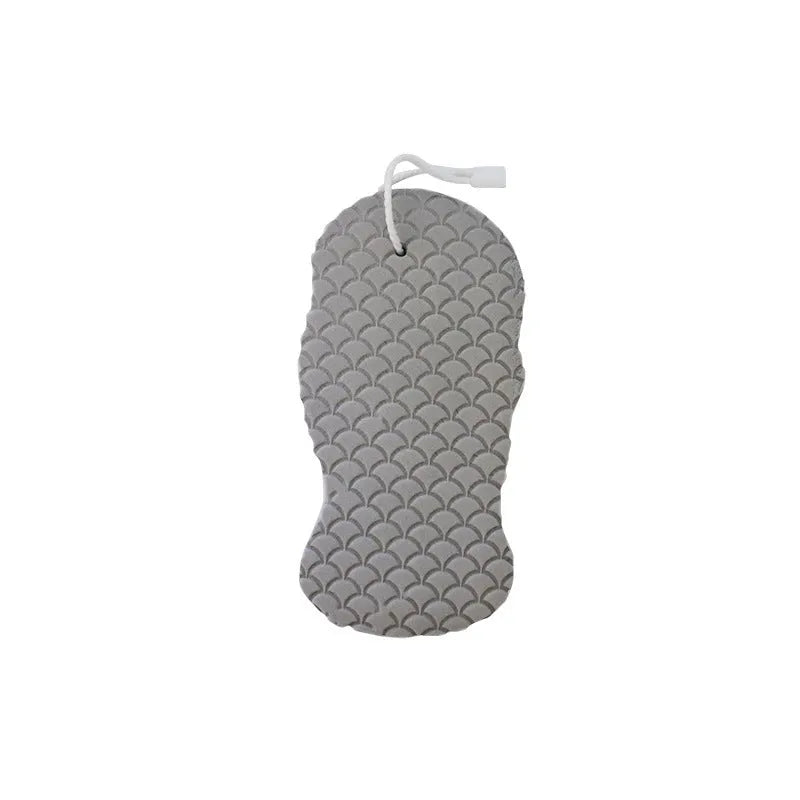 White 3D fish scale pattern bath sponge ball with hanging loop on a grey background.