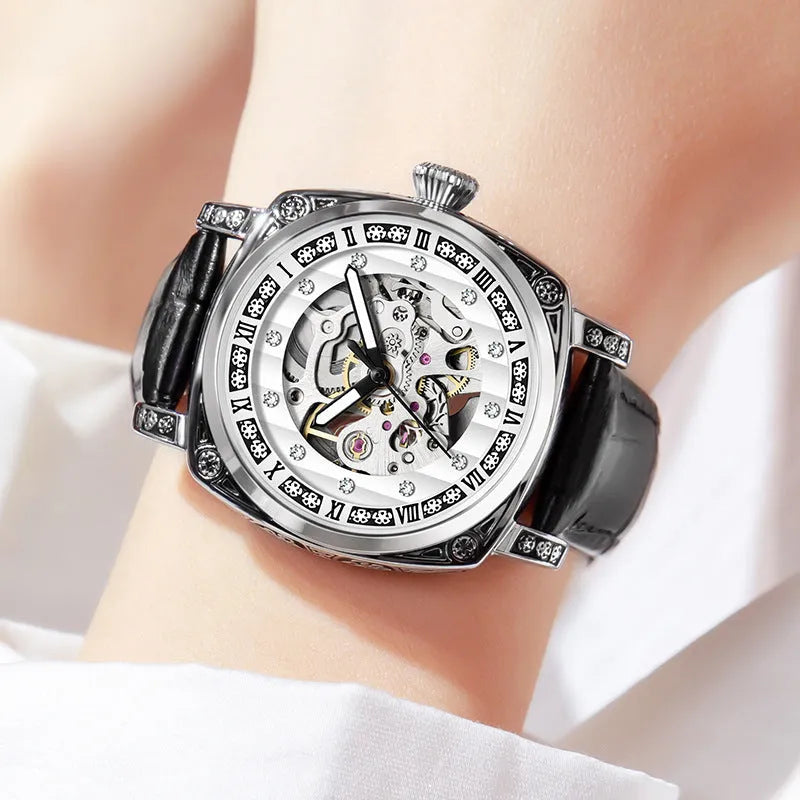 Leather strap mechanical watch with luminous hands showing 10 metre water resistance rating.