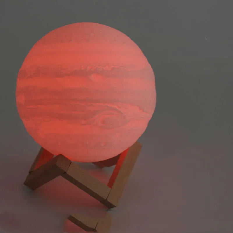 3D printed moon light lamp on wooden stand with detailed lunar surface, showing touch ring at base.