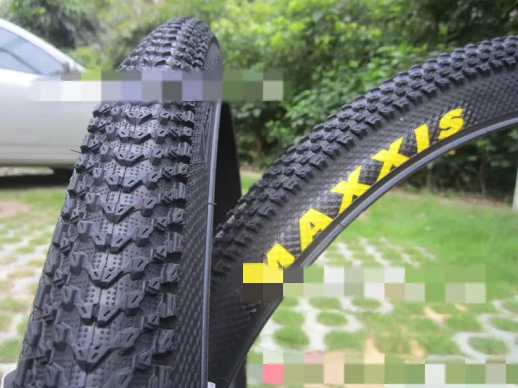 Ultralight mountain bike tyre with black tread, shown in 26, 27.5 and 29 inch sizes