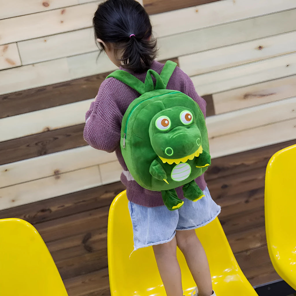 Blue dinosaur plush backpack with embroidery details and soft handle