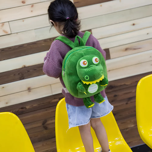 Blue dinosaur plush backpack with embroidery details and soft handle