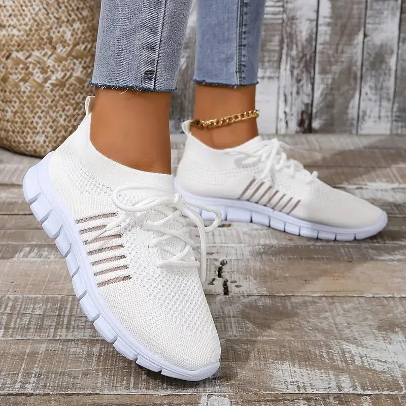 Women's black flying knit casual flat shoes with mesh upper and front tie lace.