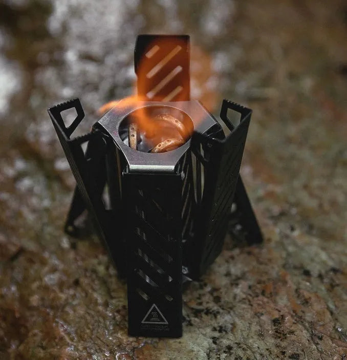Hexagon-shaped foldable alcohol stove for camping with black alloy construction