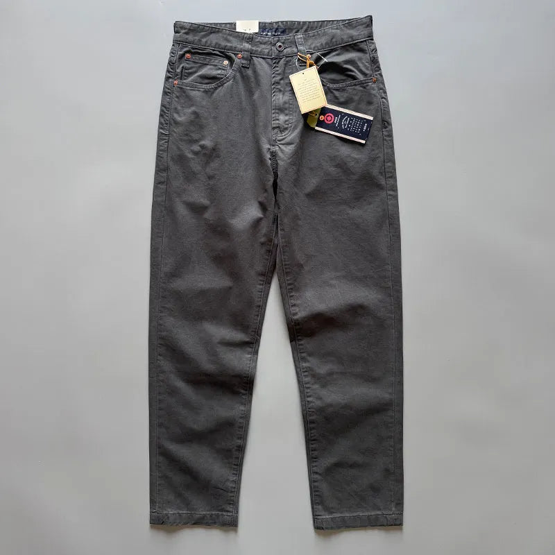 Men's straight leg cotton casual trousers in grey, shown on a model.