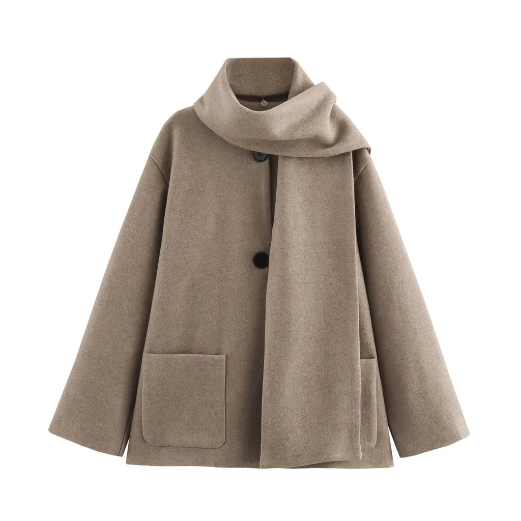 Women's long grey polyester coat with an artificial fur collar and pockets.