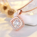 Sterling silver heart-shaped pendant necklace with crown and bow details on an adjustable chain.