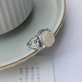 Copper vintage ring with adjustable opening and imitation white chalcedony stone