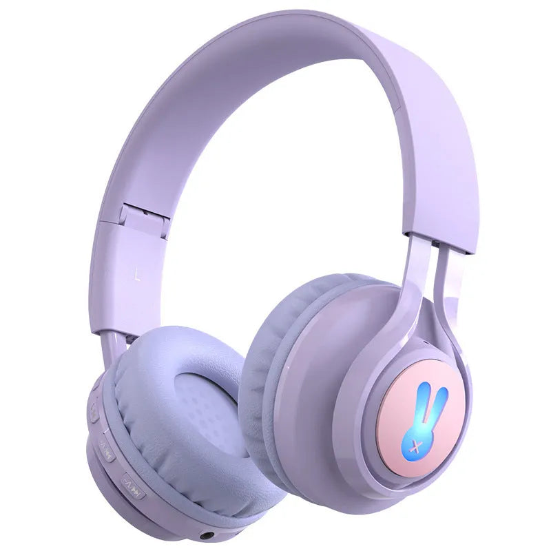Children's wireless headphones with RGB lights in bunny pink colour showing power display and microphone