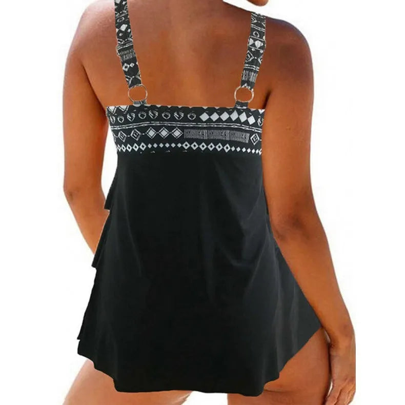 Women's plus size swimsuit with double shoulder straps, bow detail, and split skirt design in picture colour