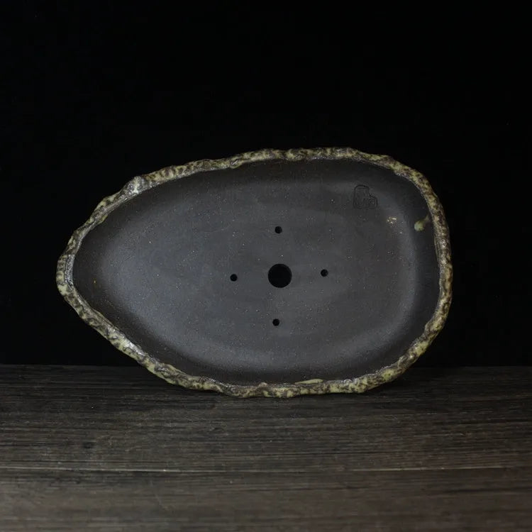 Handmade purple clay flower pot showing traditional craftsmanship and floor-standing design