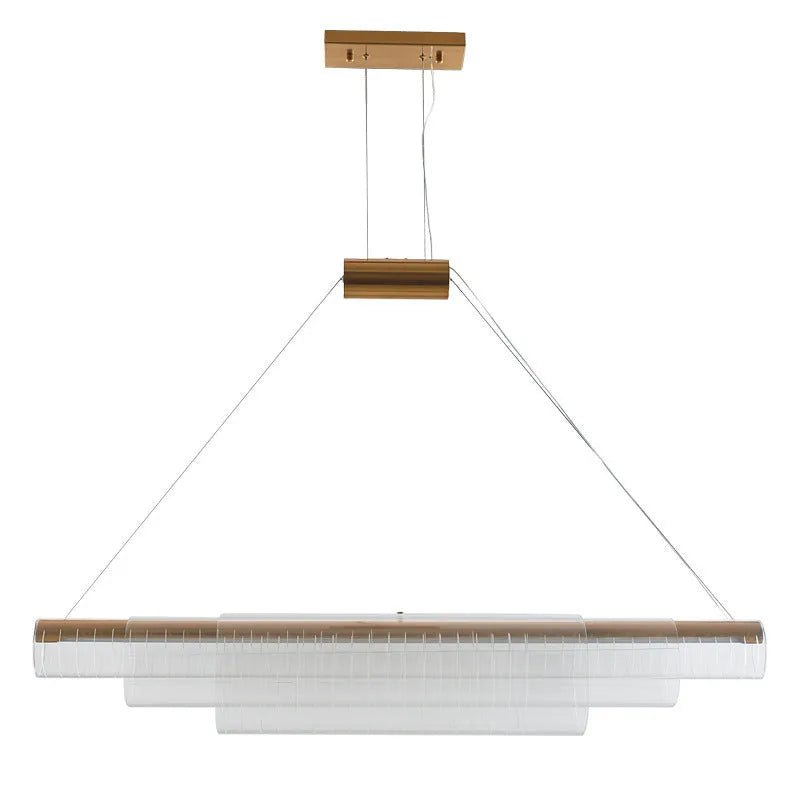 Modern clear glass and iron LED pendant light hanging at three different lengths.