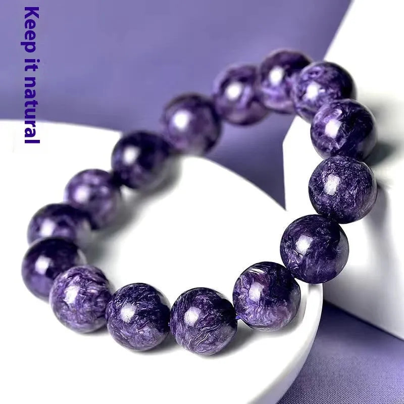 Natural transparent charoite beaded bracelet with platinum accents available in 6mm to 12mm sizes