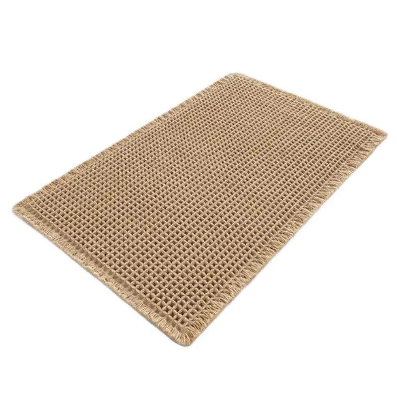 A checkered pattern non-slip polyester bathroom floor carpet shown in a beige colour.