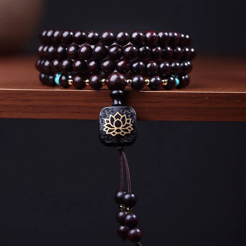 Zambia rosewood Buddha beads bracelet with flat lotus pendant showing 108 beads