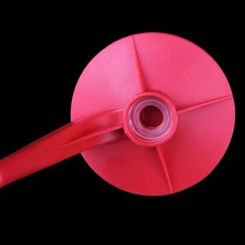Red plastic Magic Tap soda bottle dispenser with push-button tap for 2-litre bottles.