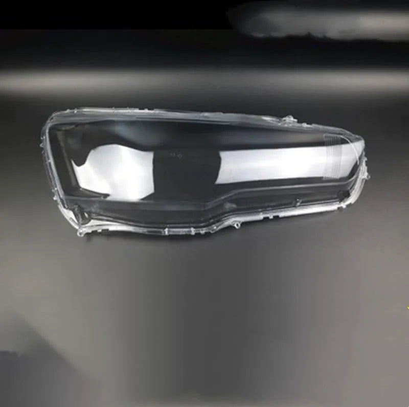 Transparent plastic headlight housing cover for car lighting replacement measuring 50x30x20mm