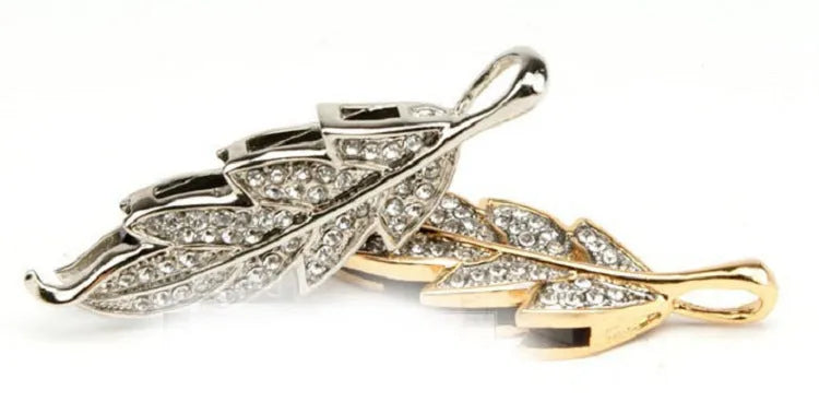 Silver metal USB flash drive shaped like a crystal maple leaf on a keyring.