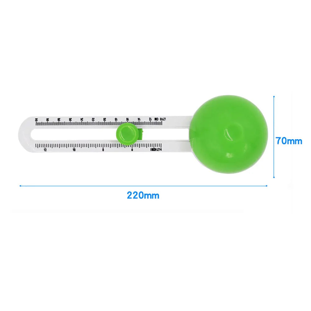 Green and orange plastic A3 round paper cutter on a colour box.