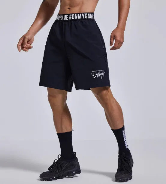 Men's loose fit cropped sports shorts in grey, blue or black with elastic waist