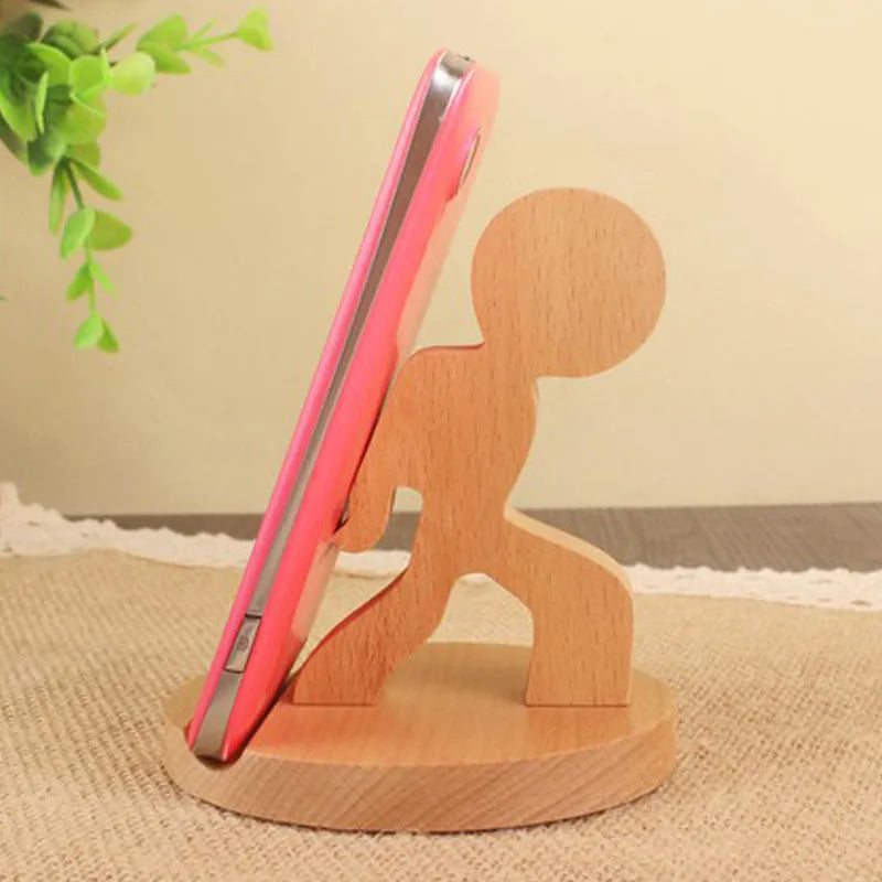 Solid beech wood mobile phone stand with a decorative resin animal ornament and a coin slot.