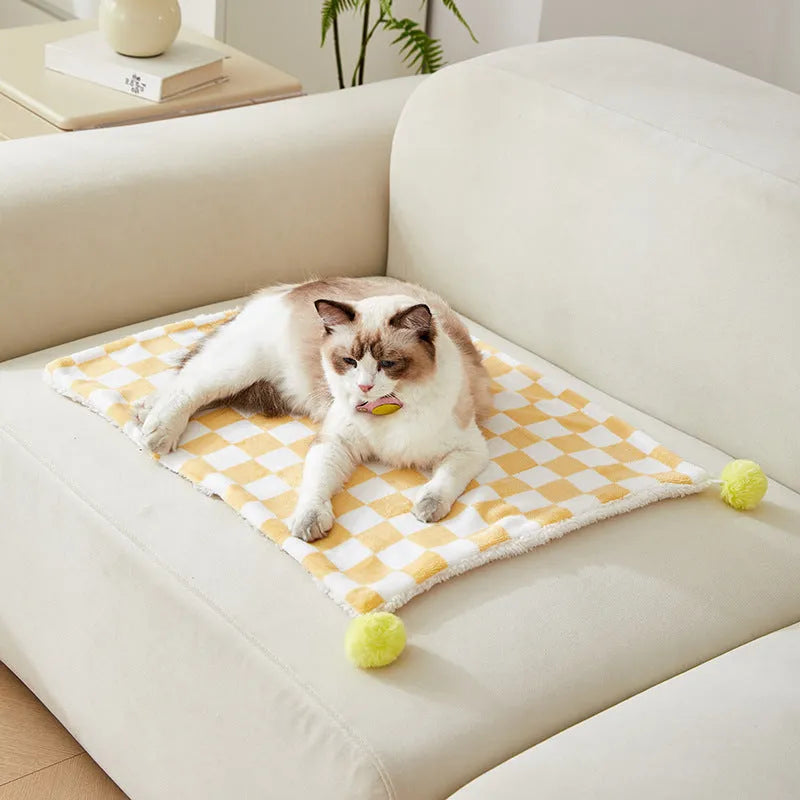 Plaid pattern pet blanket with fur ball decoration in green, pink, or yellow colours