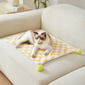 Plaid pattern pet blanket with fur ball decoration in green, pink, or yellow colours