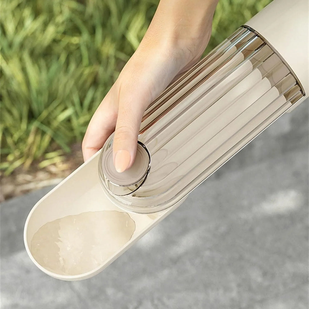 Beige foldable dog water bottle with food container at base, shown extended and collapsed.