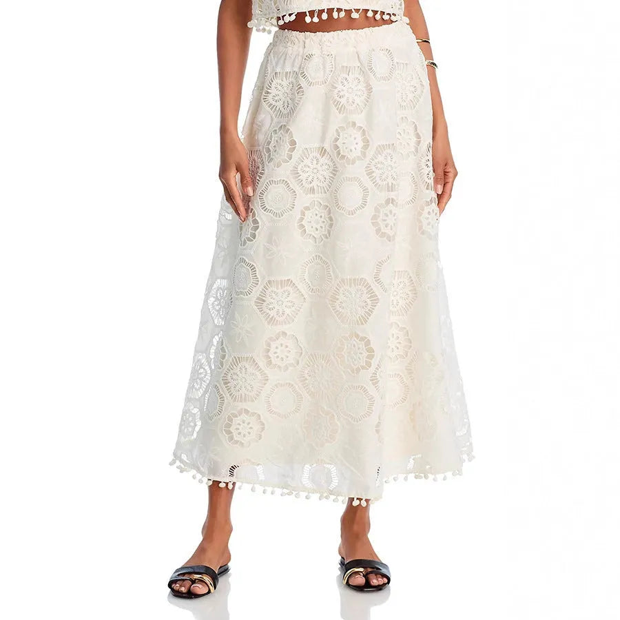 White women's two-piece suit set with embroidered sleeveless top and long skirt in retro style