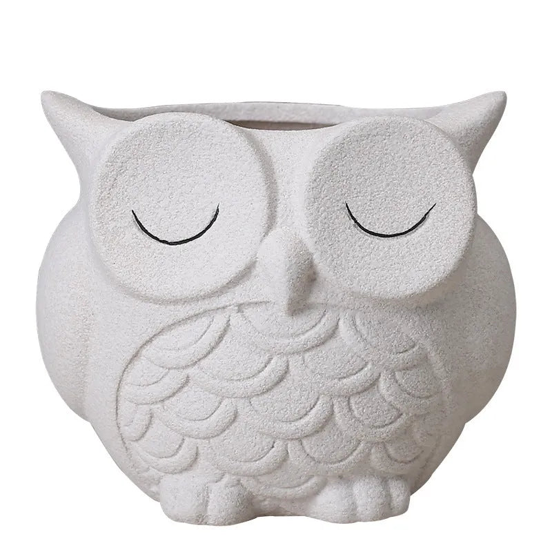Handmade ceramic owl-design succulent pot in pastel colour measuring 11cm by 9cm by 9cm