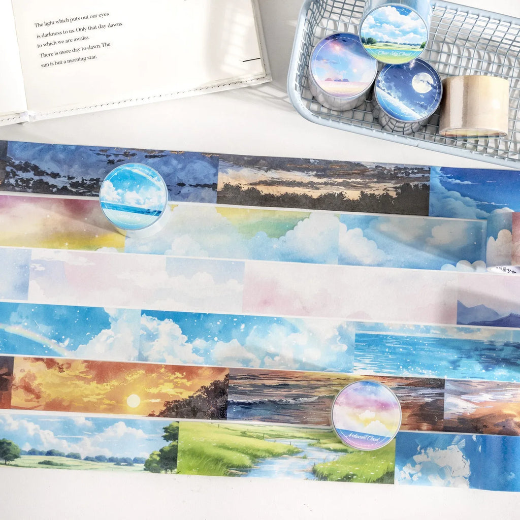 Roll of 30mm wide sky-themed Japanese paper washi tape showing colourful cloud design