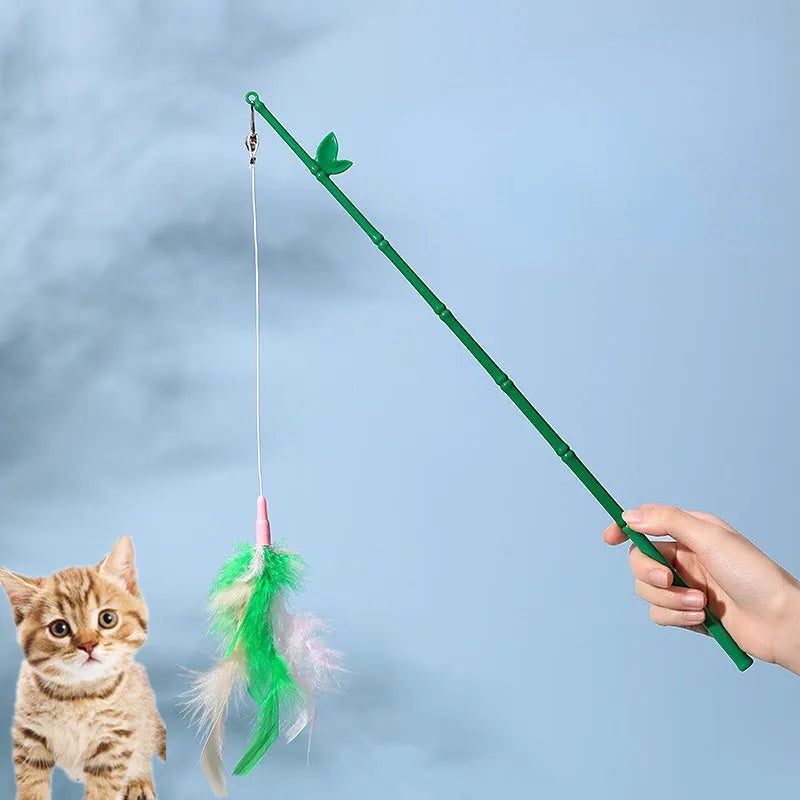 Green interactive cat feather wand toy with bell attachment and a comfortable grip handle.