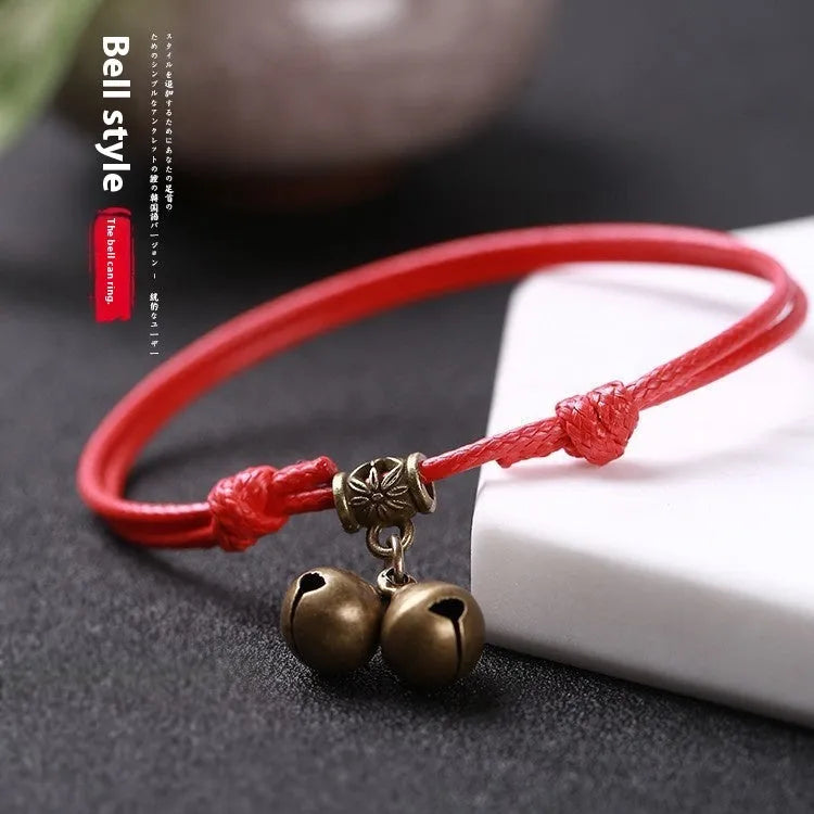 Adjustable nylon rope dog collar with brass bell in black, red, or coffee colours showing 8-17cm sizing