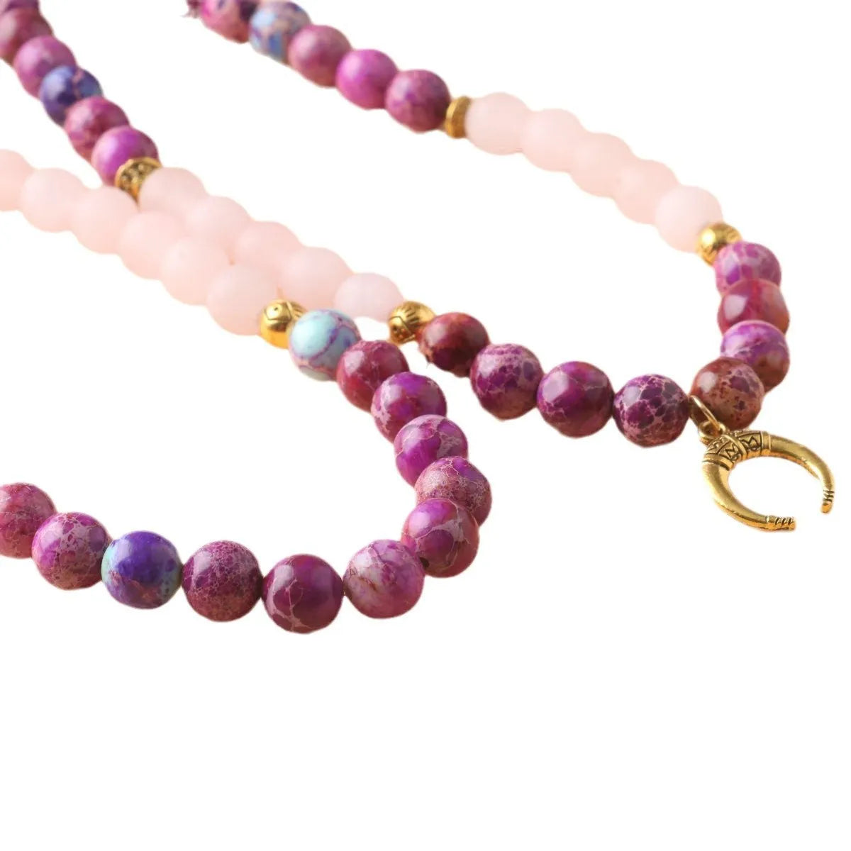 Pink crystal Emperor Stone beads pendant necklace on model, showing round beads and adjustable chain