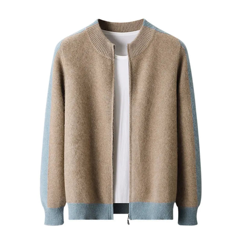 Man wearing a dark blue thick wool zip-front cardigan with a half turtleneck collar.