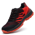 Red low-top protective safety shoe with steel toe cap and mesh upper.