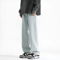 Men's light blue straight leg jeans with button waist on hanger