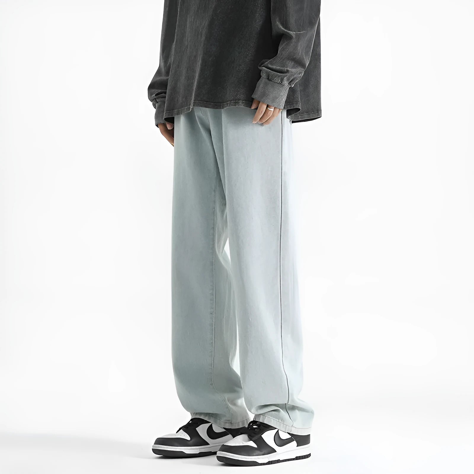 Men's light blue straight leg jeans with button waist on hanger