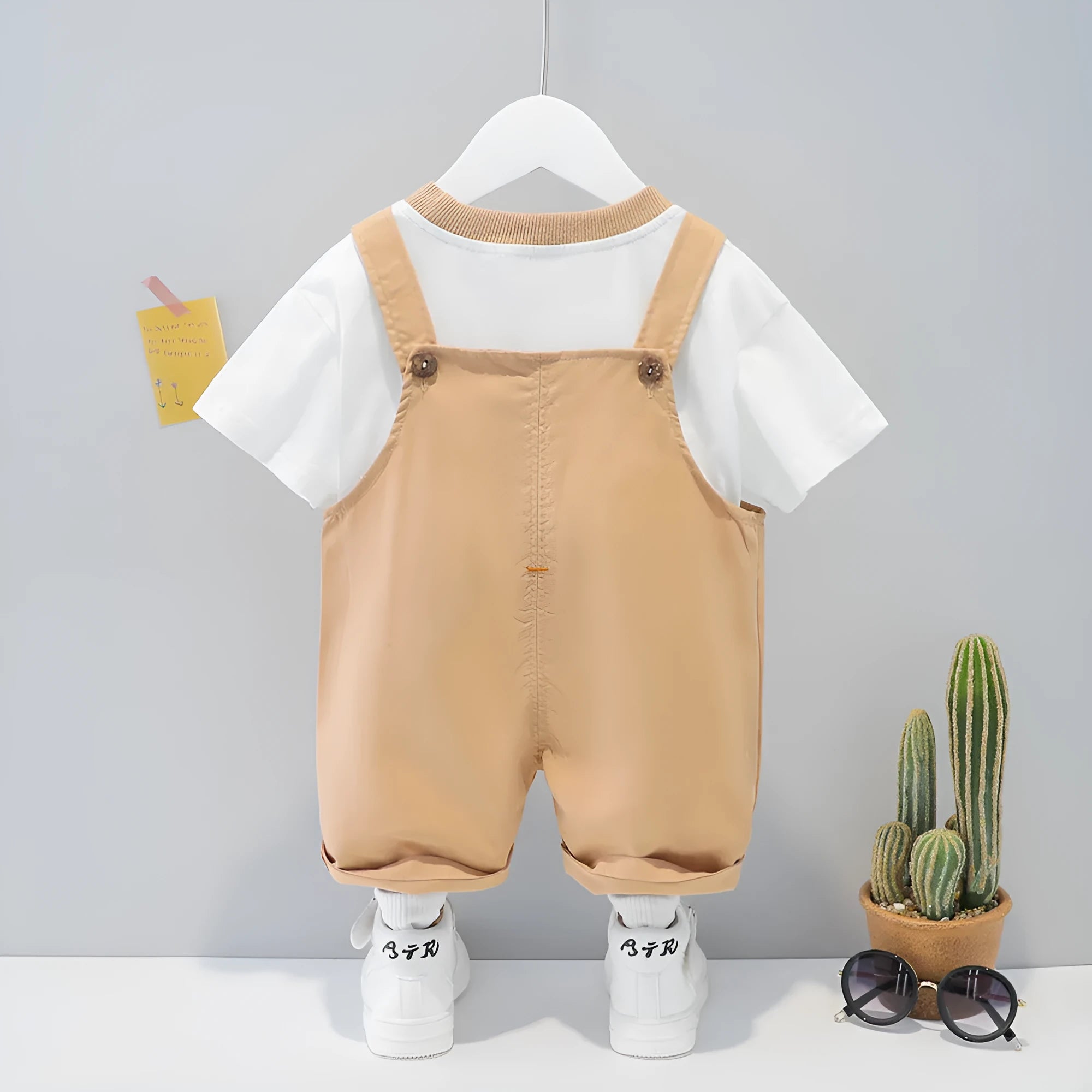 Baby wearing cotton summer overalls with cartoon print and adjustable straps