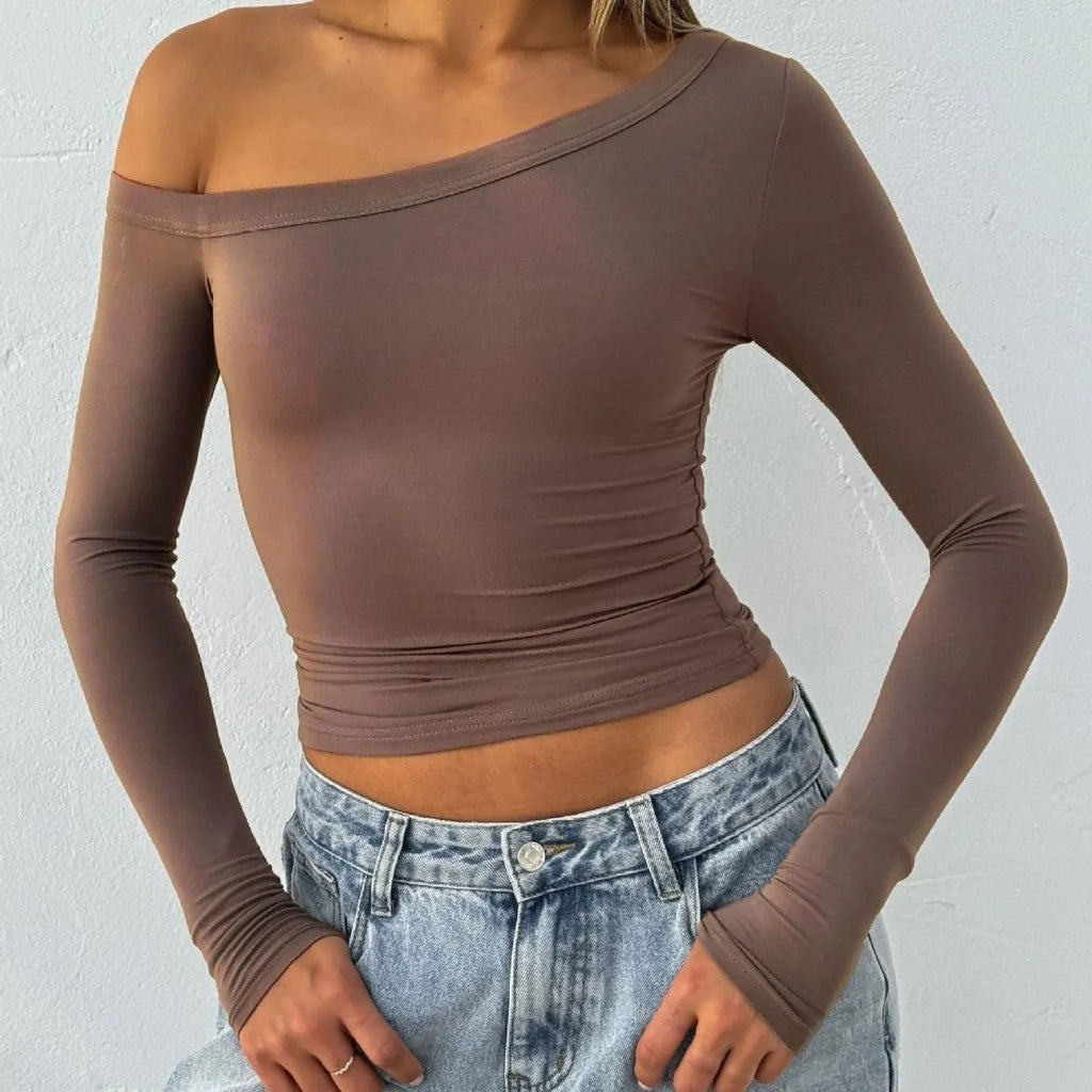 Women's slim fit knitted cardigan with cross shoulder straps in black, brown, or red.