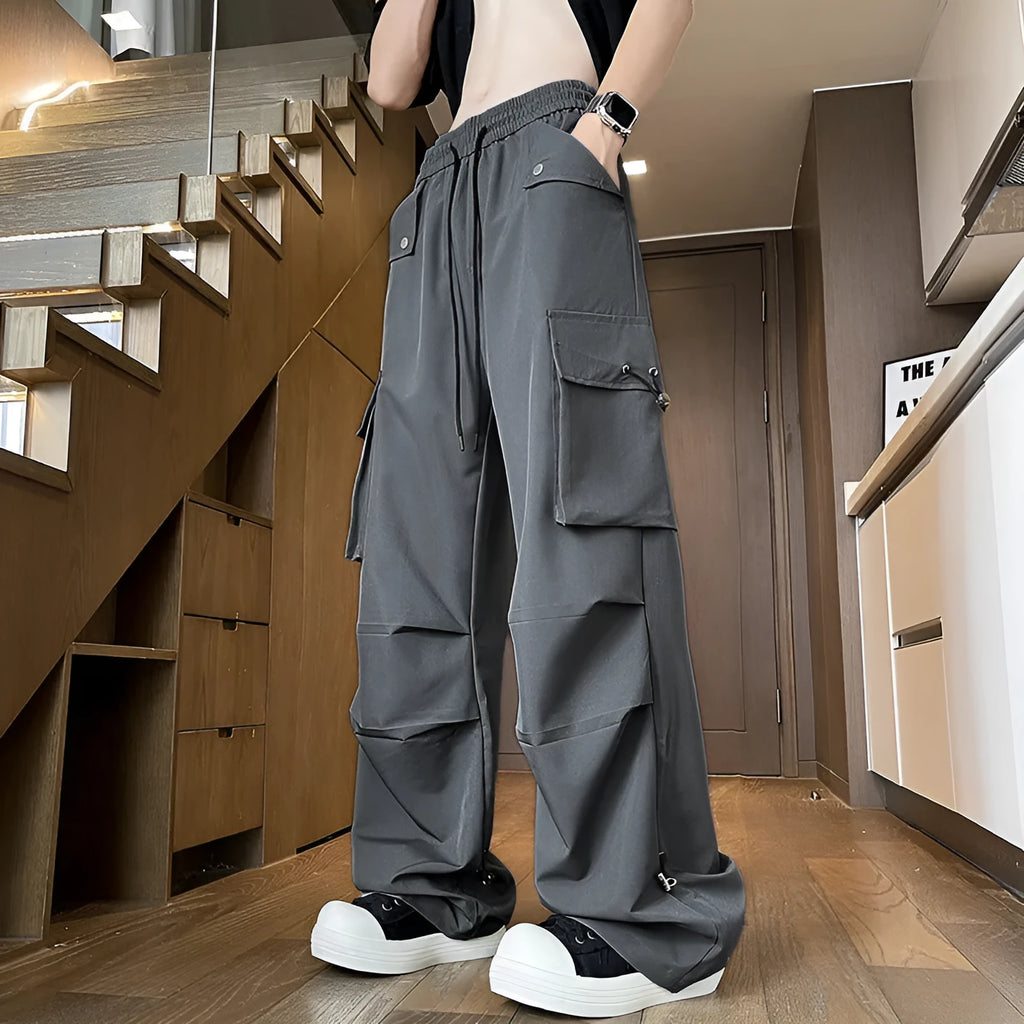 Plus size waterproof straight leg trousers in black, white or grey with drawstring waist