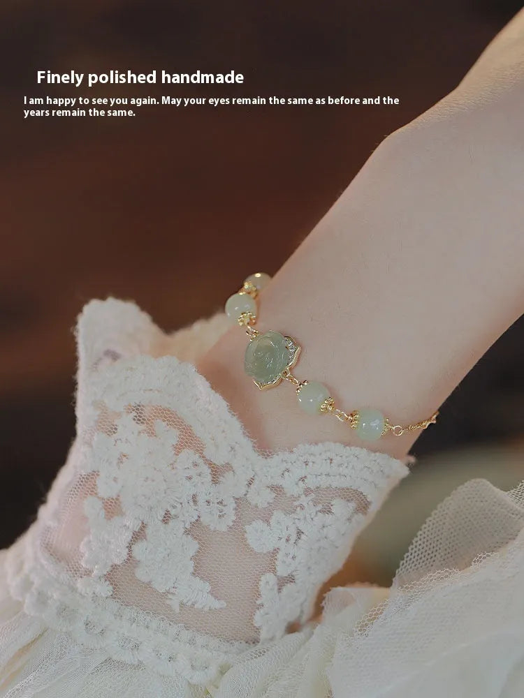 Women's bracelet with Hetian jade rose flower pendant on gold chain