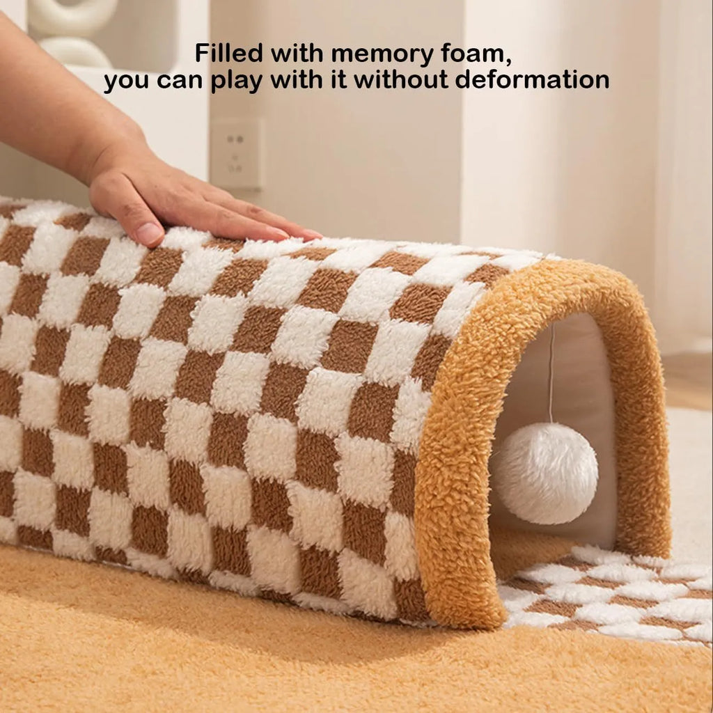 XL sized fan-shaped plush pet bed with integrated tunnel, shown in coffee colour with a non-slip granular base.