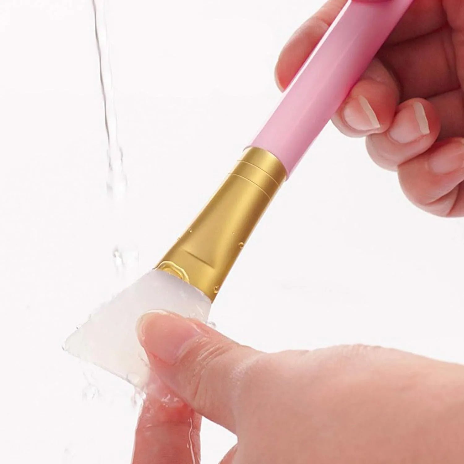 Reusable silicone face and body mask applicator spatula in various colours.