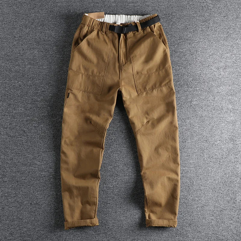 Men's cotton work trousers with N I buckle belt in dark blue colour showing three-dimensional cutting construction